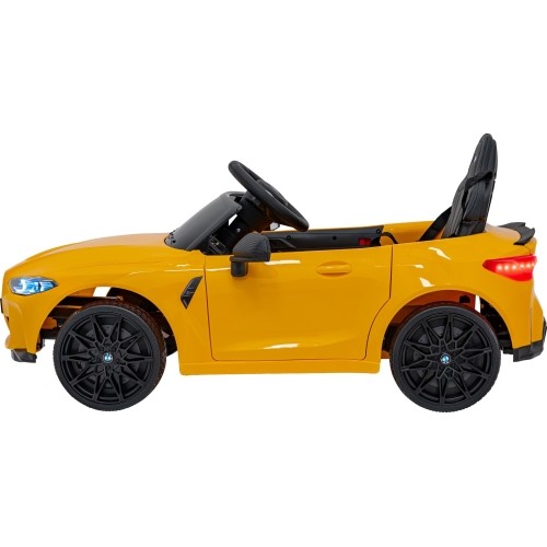 Pojazd elektryczny BMW M4, żółty