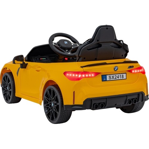 Pojazd elektryczny BMW M4, żółty