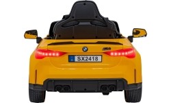 Pojazd elektryczny BMW M4, żółty