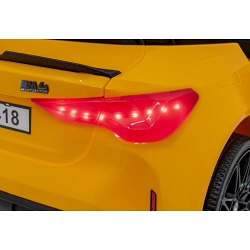 Pojazd elektryczny BMW M4, żółty