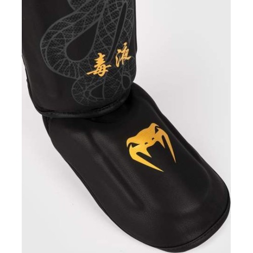 Nagolenniki Venum Serpenti - czarny/srebrny/złoty