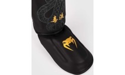Nagolenniki Venum Serpenti - czarny/srebrny/złoty