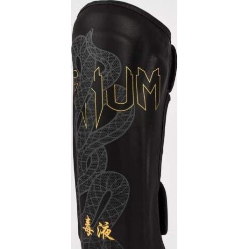 Nagolenniki Venum Serpenti - czarny/srebrny/złoty