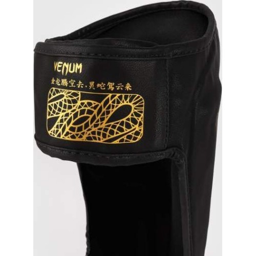 Nagolenniki Venum Serpenti - czarny/srebrny/złoty