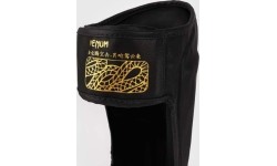 Nagolenniki Venum Serpenti - czarny/srebrny/złoty