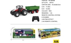 Czerwony traktor zdalnie sterowany z zieloną naczepą