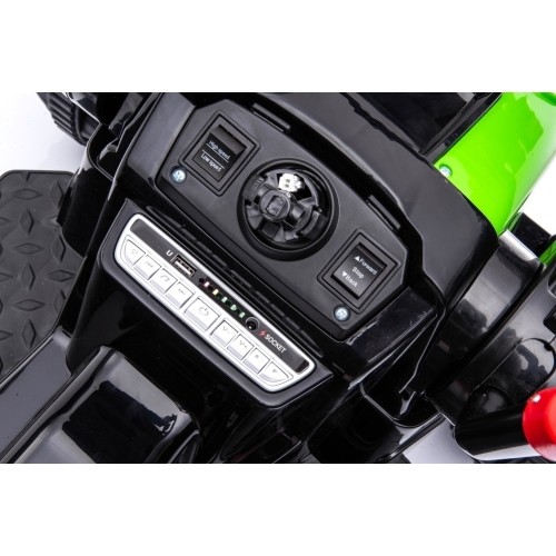 Pojazd elektryczny traktor z koparką, zielony