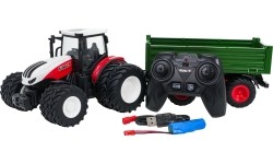 Czerwony traktor zdalnie sterowany z zieloną naczepą