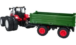 Czerwony traktor zdalnie sterowany z zieloną naczepą